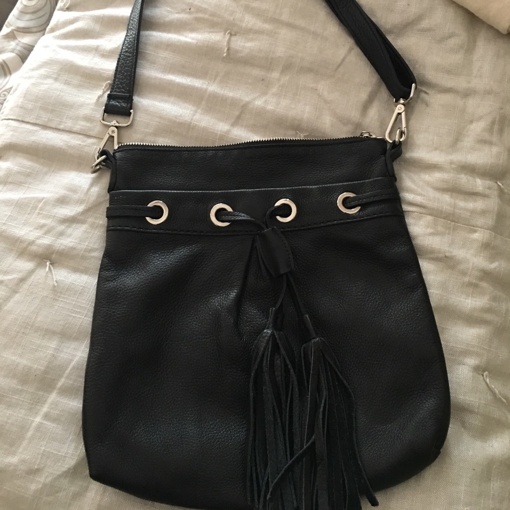 Roots black pebble leather cross body bag.